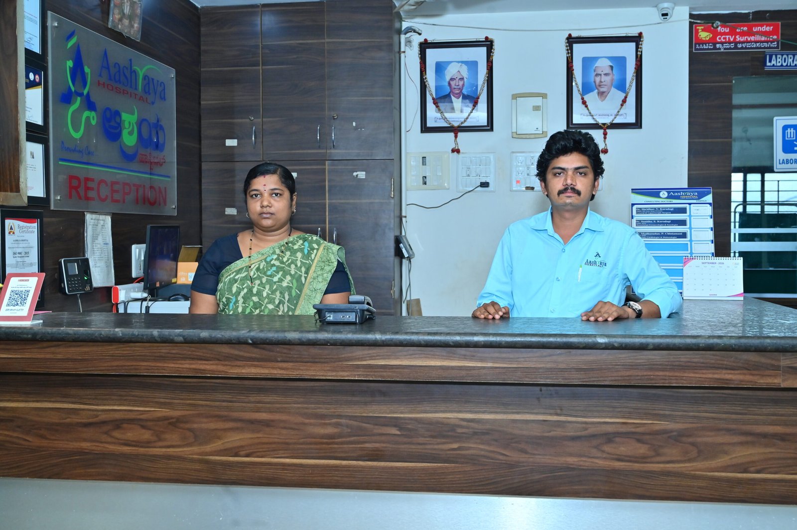 Aashraya Hospital insurance desk assisting a patient with cashless health insurance treatment